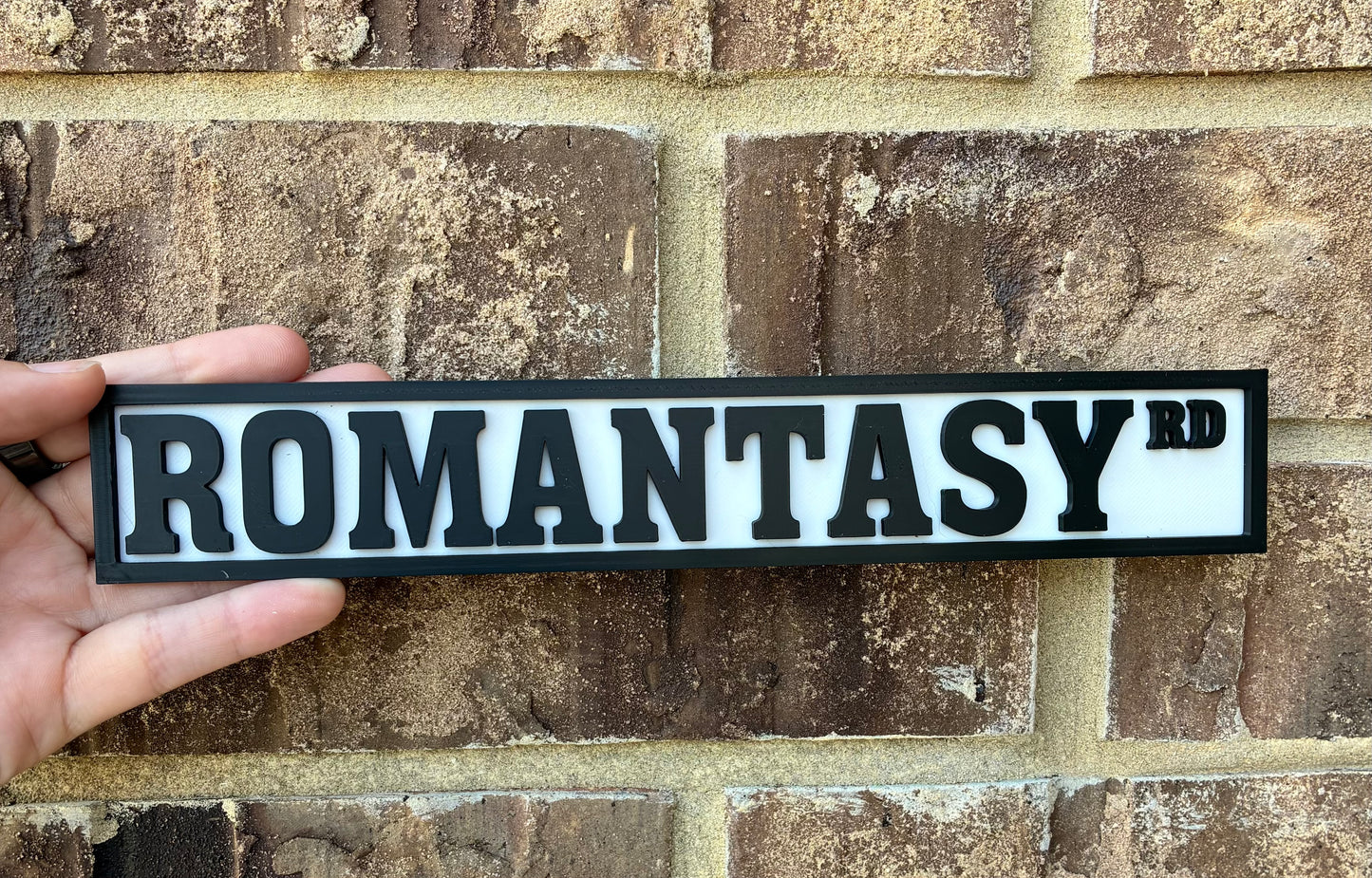 Romantasy bookshelf street sign