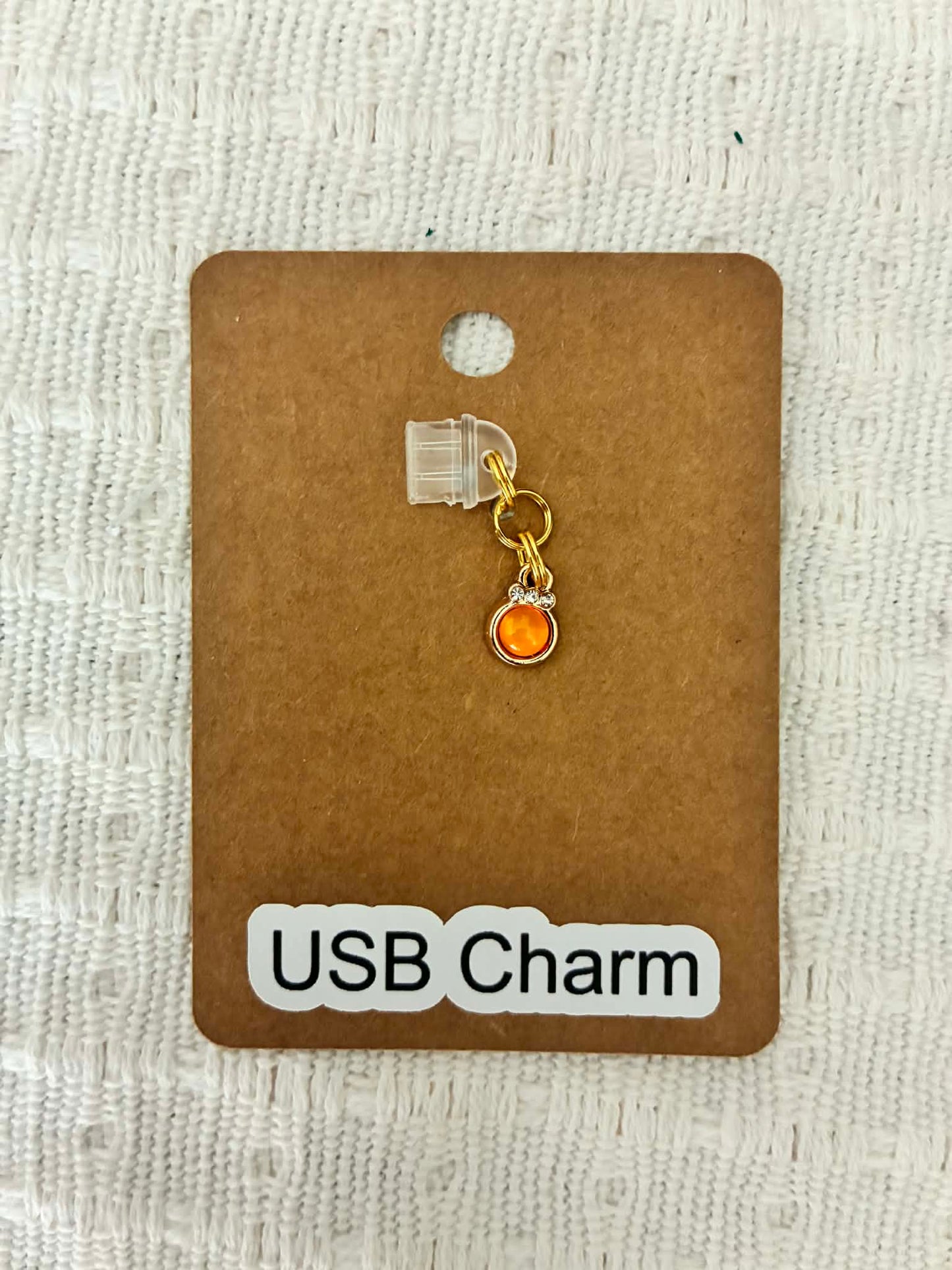 Orange gem dust charm