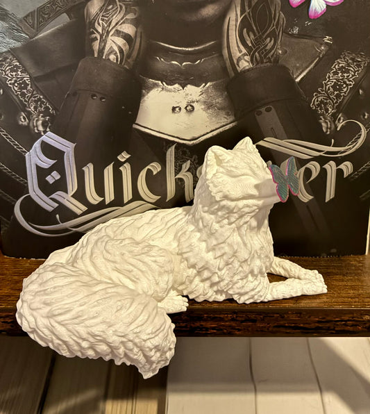 Arctic fox with butterfly